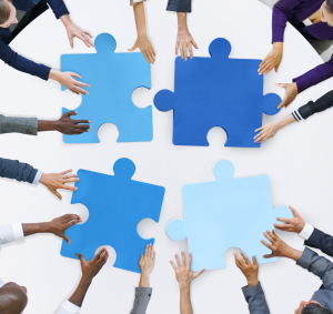 Business People and Jigsaw Puzzle Pieces